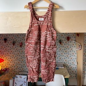 Bobo Choses waves overalls.